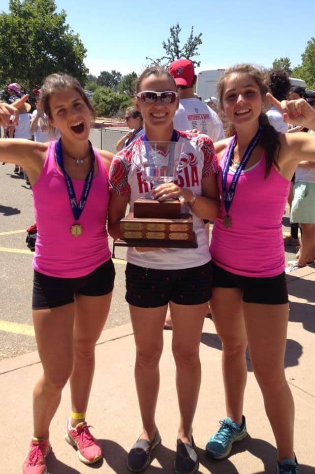 New Canaan's Mary and Claire Campbell, with coach Ana Cherednikova, celebrate after winning a gold medal at the USRowing Youth National championships Sunday in California.