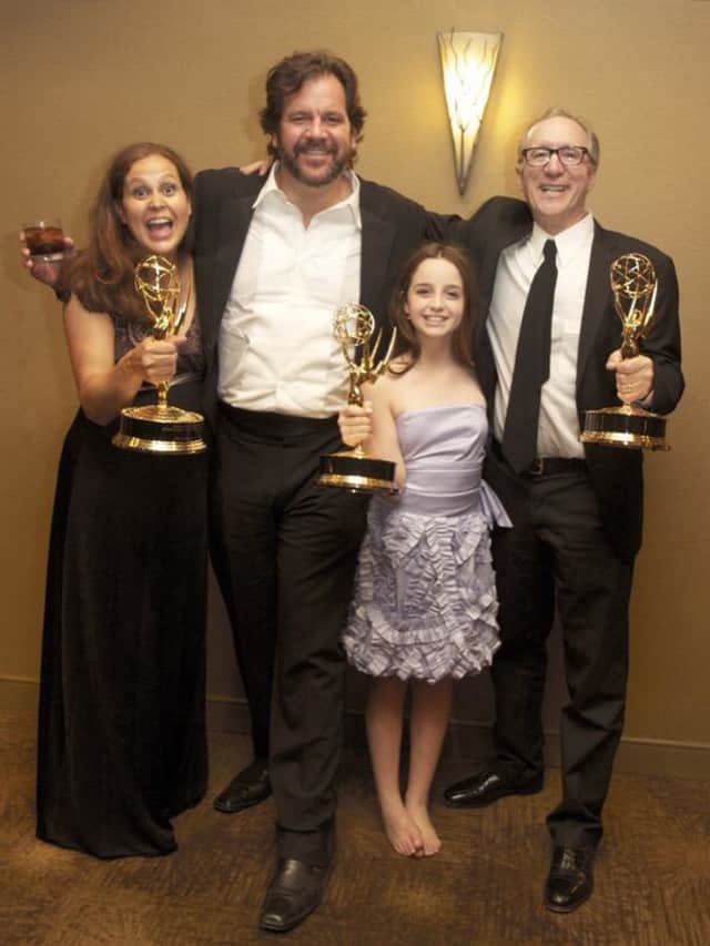 Hayley Negrin of Weston, second from right, poses with her Emmy and other winners from 'Peg + Cat.' 