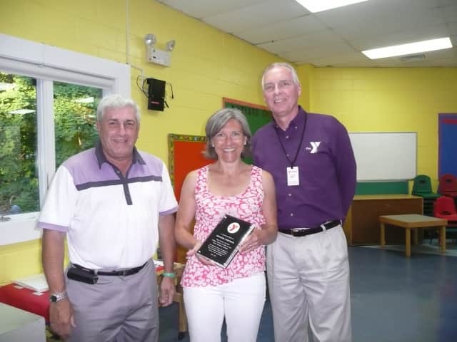 From left are Y Board President Howard Steinberg, Katherine Armstrong, and Y Executive Director Bob McDowell. 