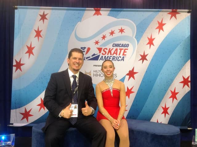 Redding skater Brooklee Han and her coach Serhii Vaypan celebrate her new personal best score in the Kiss and Cry at the Skate America competition over the weekend. 