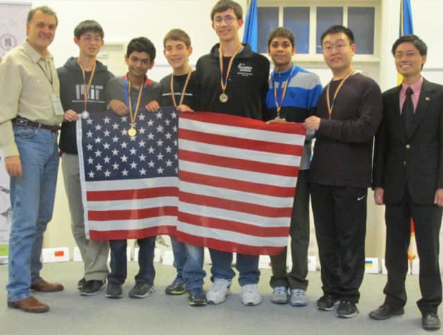 Greenwich High School senior Michael Kural, center, received one of 10 gold medals in the 2015 Romanian Master of Mathematics (RMM) competition. The international competition was held in Bucharest, Romania, from Feb. 25 to March 1.