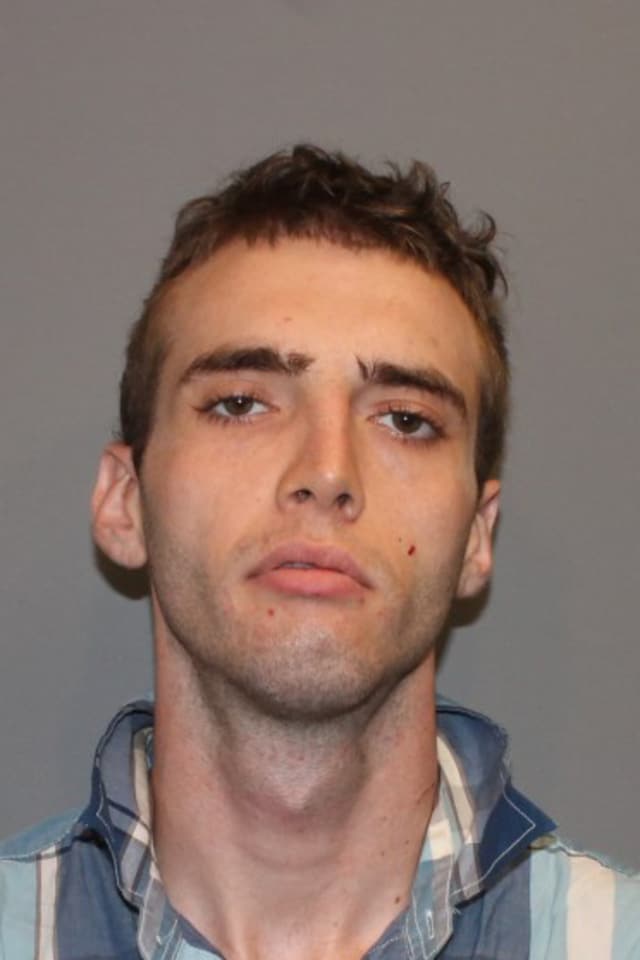 Aaron Everhart, 24, was charged with beating up another man after the two were involved in an accident in Norwalk.