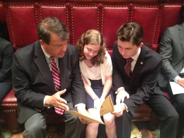 Dana Gallagher, center, of Mamaroneck (Rye Neck High School) and Jack Flannery, right, of Eastchester High, confer with state Sen. George Latimer, D-Rye, at the state Senate chambers in Albany during their internships.