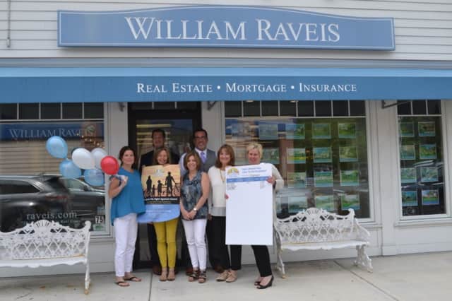 William Raveis Team Chappaqua pictured left to right in front: Elise Levine Cooper, Jean Cameron-Smith, Sue Labate, Lori Lerner, Susan Myers; back: Glenn Felson and Paul Menga.