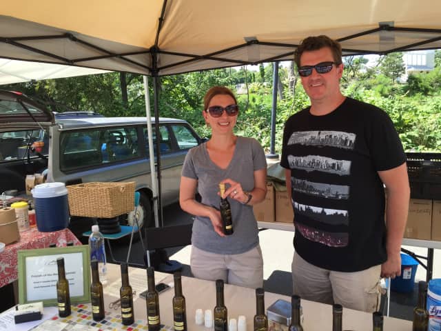 Dee and Alina Lawrence pose in their booth at the Westport Farmers Market Thursday.