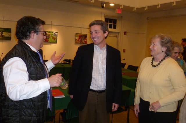 John Engel, center, is elected to the New Canaan Town Council on Thursday. He is flanked by First Selectman Robert Mallozzi III and Councilwoman Penny Young. 
