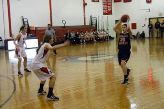Horace Greeley High School senior point guard Jackie Brett (r.) needs just 11 points to reach the 1,000-point milestone for her career.