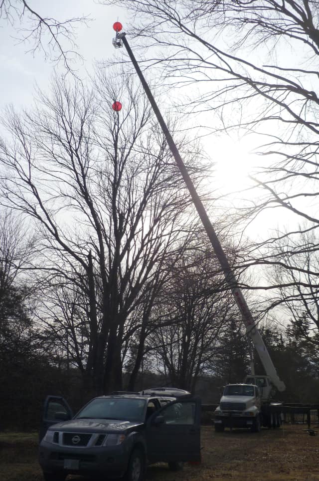 A pair of red balloons were lifted over a New Canaan property Friday to test the site for location of a Verizon cell phone tower. 