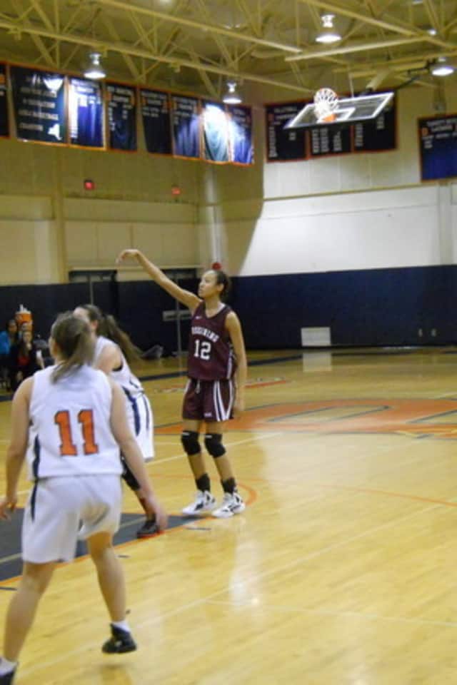 The Women's Basketball Coaches Association named Ossining High School girls' basketball star Saniya Chong (number 12) as an All-American on Tuesday.