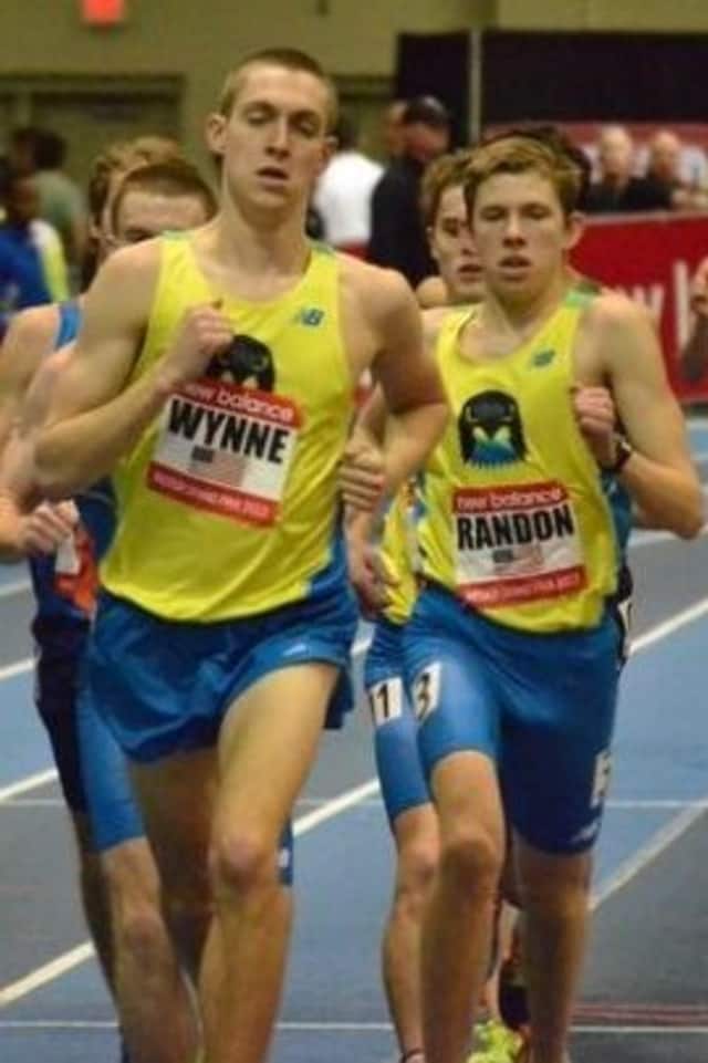 New Canaan's James Randon, right, runs with Staples' Henry Wynne during the mile at the New Balance Grand Prix.