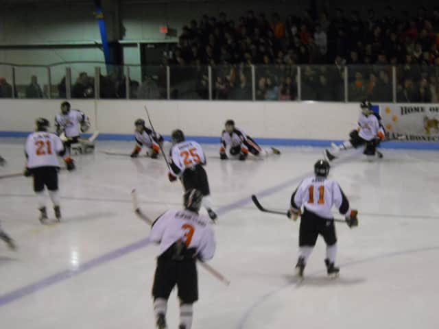 Mamaroneck, shown warming up before a period, will host Ryetown/Harrison in a quarterfinal game Tuesday in the Section 1 Division I Hockey Championships.