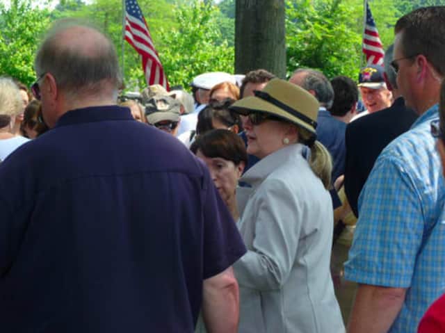 Chappaqua resident and former Secretary of State Hillary Clinton, seen here at New Castle's Memorial Day Parade last summer, will be joining the paid speaking circuit with the Harry Walker Agency.