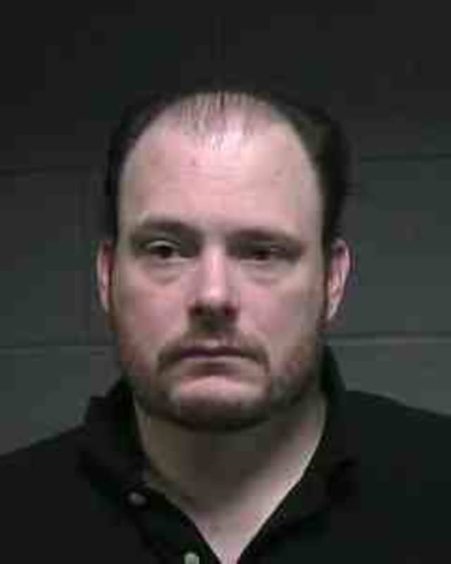 Jeremy Winter, 30, was charged with stealing from TD Bank customers' accounts to pay off his personal debts. 