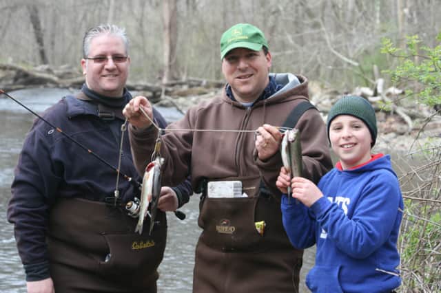 Keith Hladek, Rob Tinari and Jack Tinari display their catches in Croton Falls.