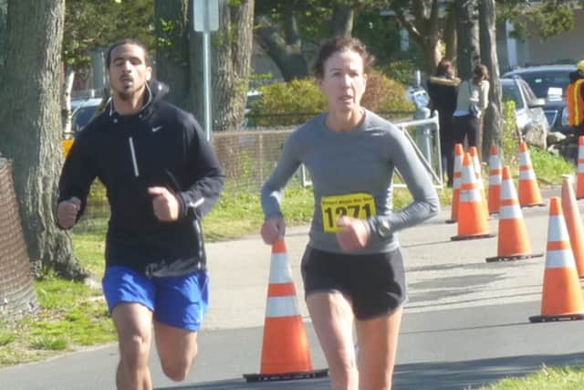 Carol Clark of Westport won her age group at las year's Minute Man 5k in Westport. The 35th annual edition of the race, which also includes a 10k and races for kids, will be run Sunday at Compo Beach.