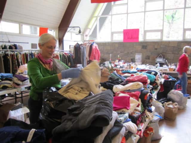Londa Wilson helps set up Briarcliff Congregational Church's Rummage Sale last year. The 101st annual sale begins Saturday morning.
