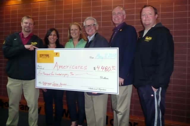 Representatives from the Wilton Y Wahoo Swim Team present AmeriCares President and CEO Curt Welling (3rd from right) with a check for $4,480. See story for full IDs.