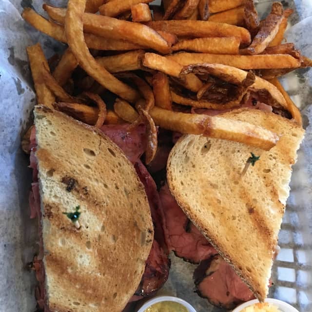 Pastrami sandwich with fries