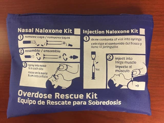 A Narcan kit contains the drugs, syringes, and gloves.
