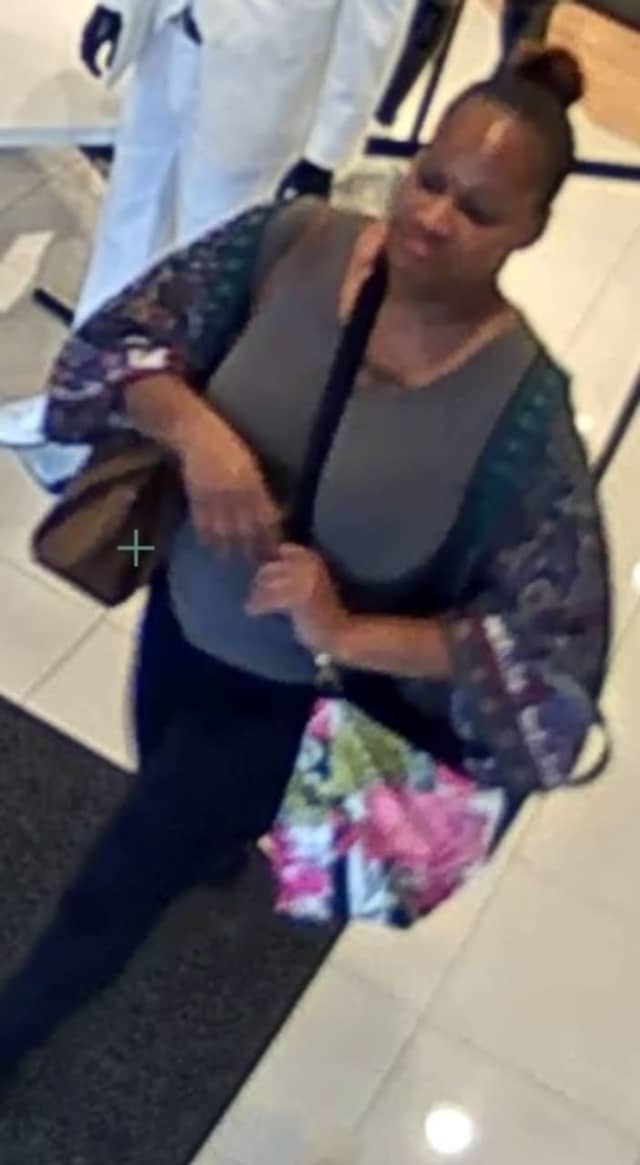 A woman seen on surveillance camera is accused of stealing shirts worth $250 from a Smithtown Macy's, according to Suffolk County Police.